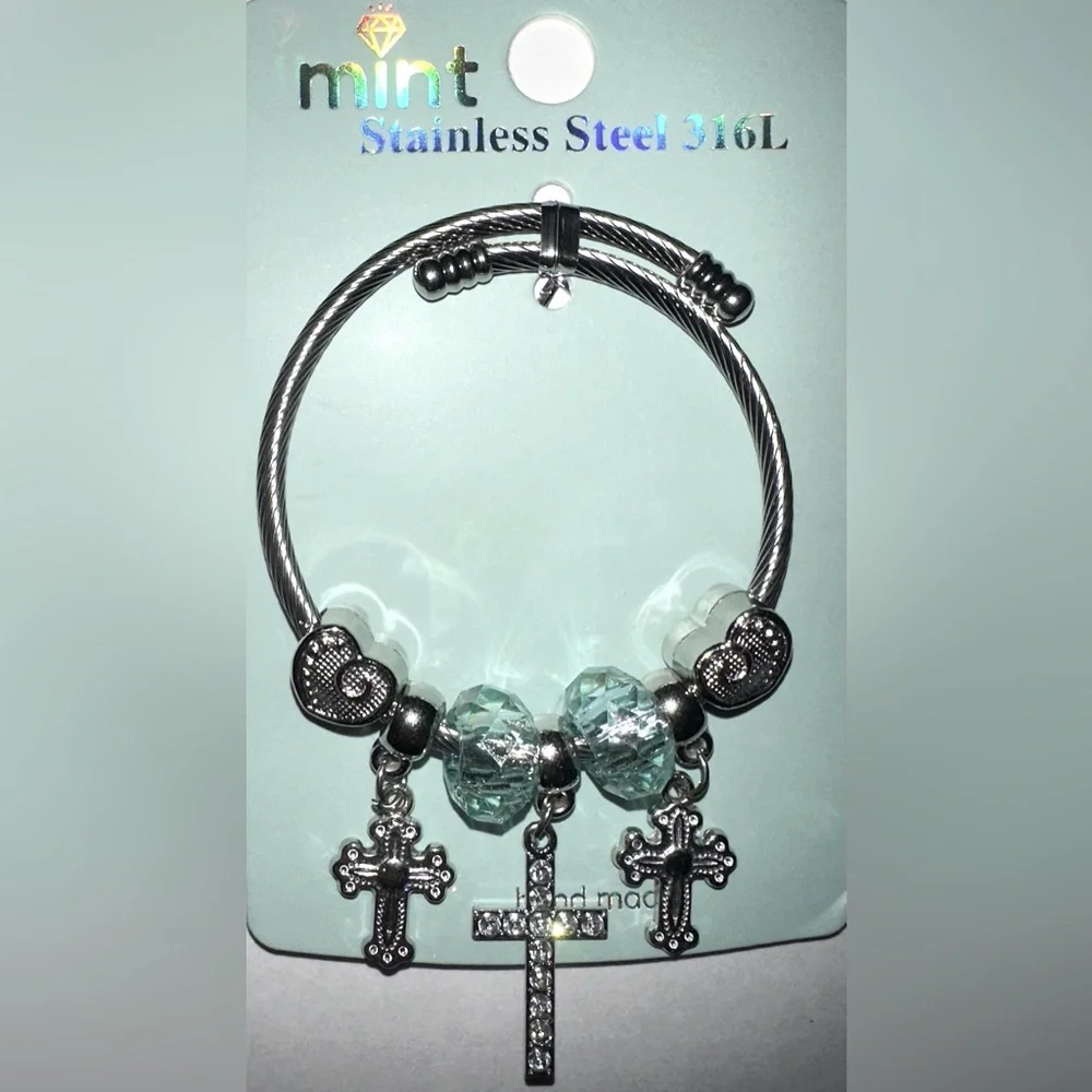 Mint Stainlees Steal Charm Bracelet with Divinity Cross, Hearts and Beads.